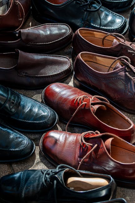 Colorful array of leather shoes on display, showcasing various styles and shades.